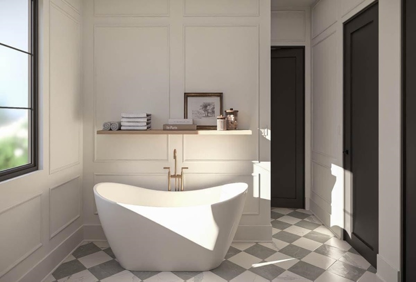Freestanding soaking tub with a floor-mounted brass faucet, set against wainscoting paneling