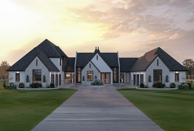 Expansive contemporary residence featuring a light-colored stone and stucco exterior