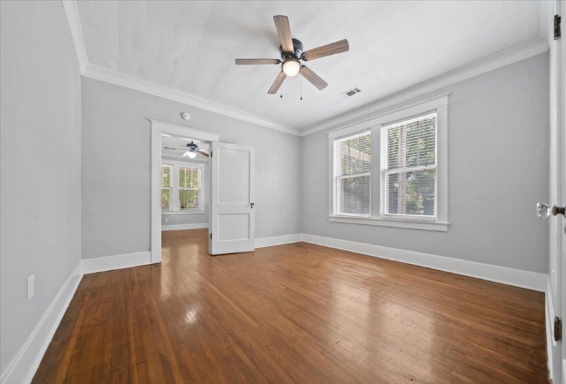 Room featuring wood-finish flooring and light gray walls
