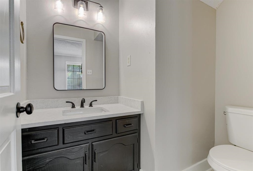 Bathroom featuring vanity and toilet