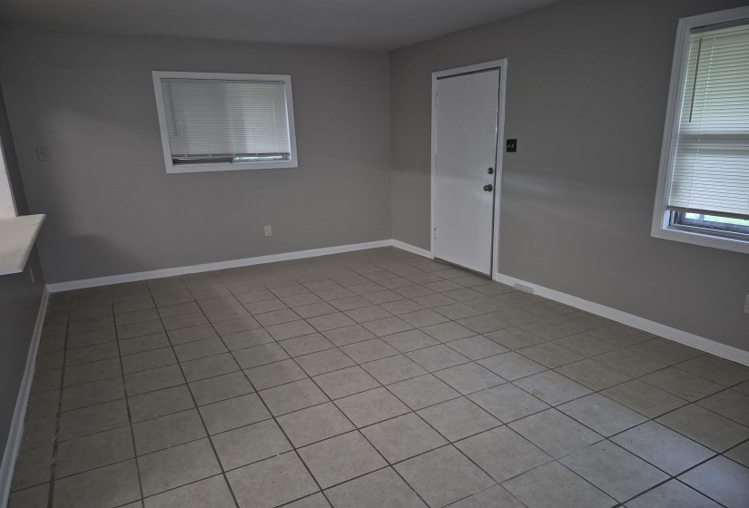 Neutral-toned tile flooring throughout