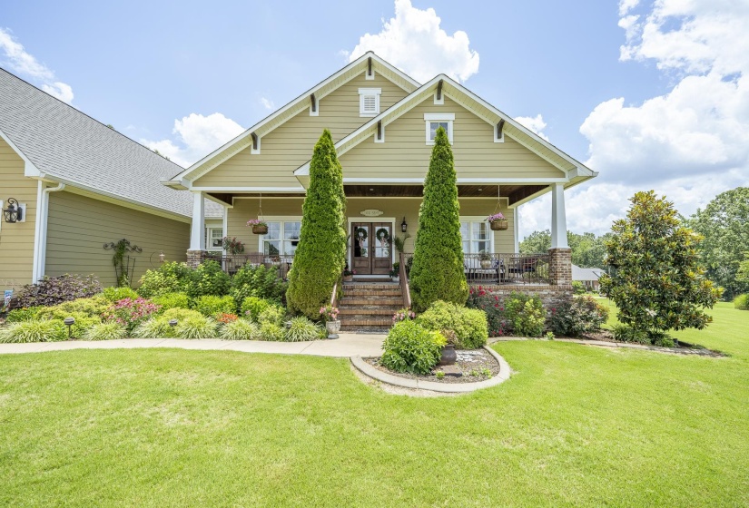 Craftsman-style exterior with a gabled roofline and light-toned siding