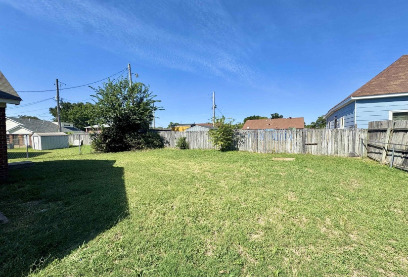 View of fenced backyard