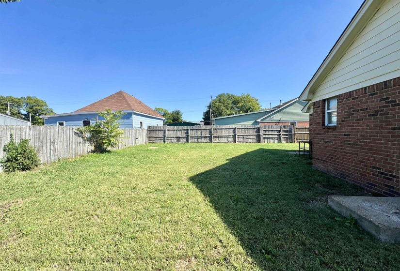 View of fenced backyard