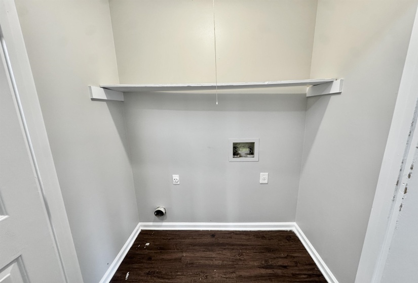 Laundry room with dark wood-style flooring and washer hookup