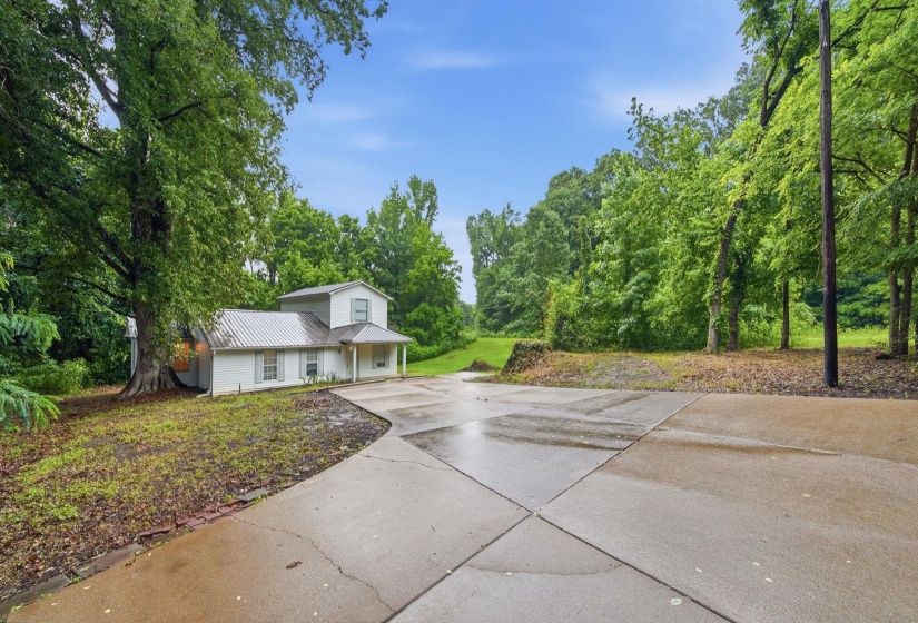 Very Nice concrete drive leading to home from Hwy.2 side parking spots.