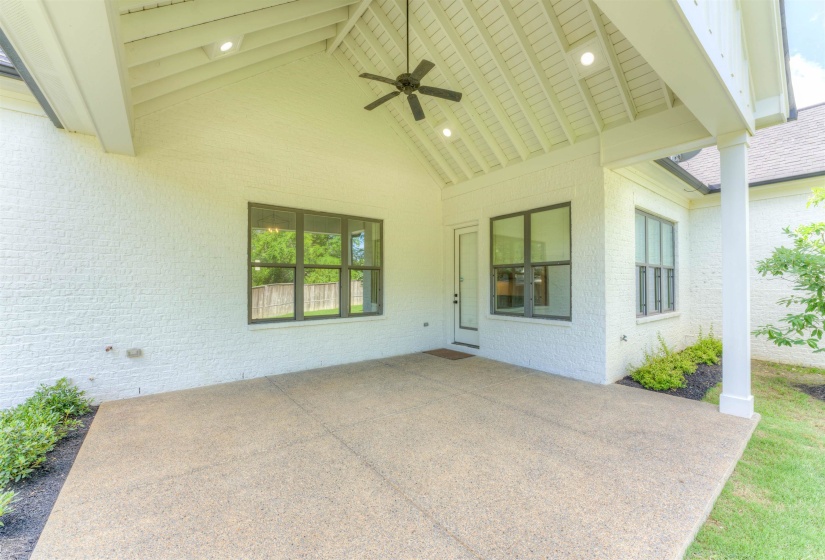 Covered patio with an exposed aggregate concrete surface