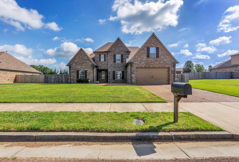 Two-story brick exterior with gabled roof lines