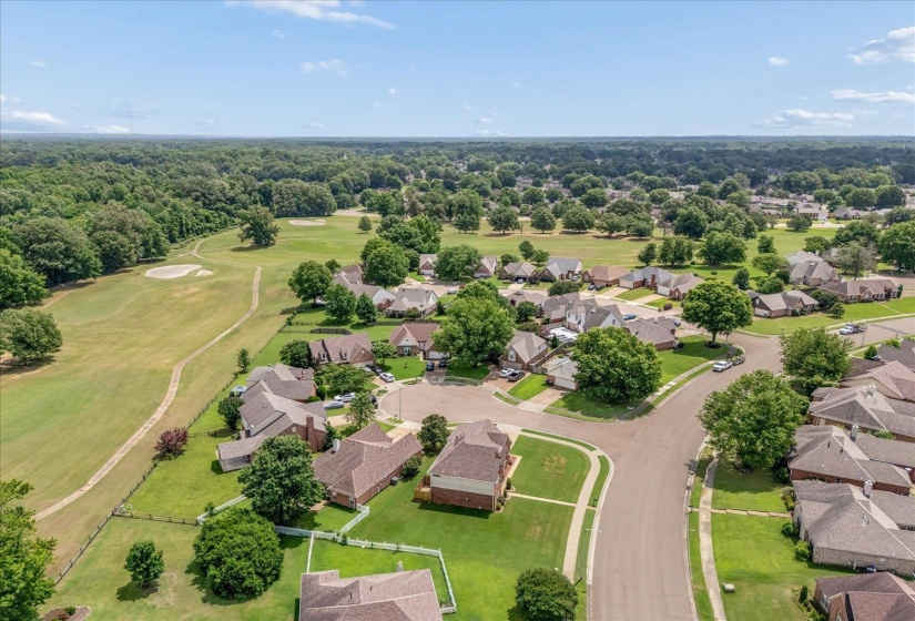 Residential community featuring mature trees and a golf course