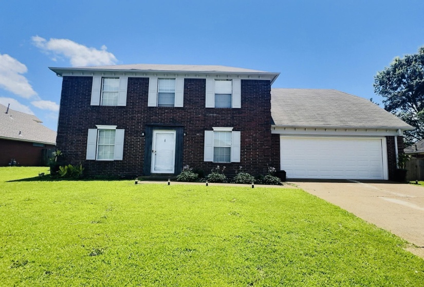 Brick exterior with white shutters