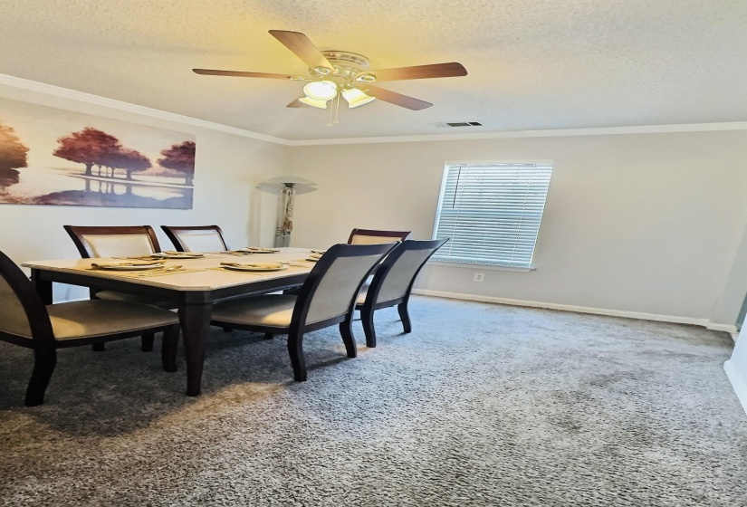 Room featuring gray carpet flooring, white baseboards, and neutral wall paint