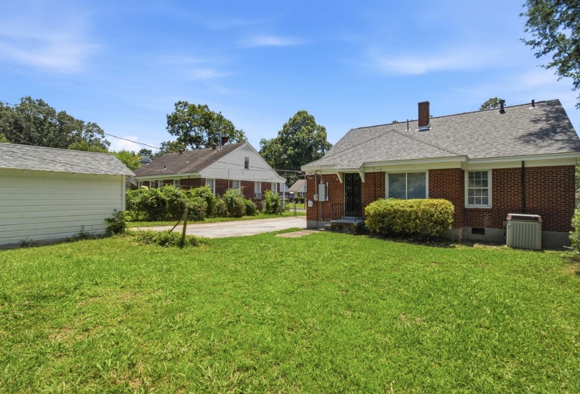 Brick exterior residence featuring a gabled roof and chimney