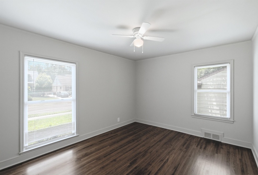Bright interior with wood-finish flooring, white walls, and white trim