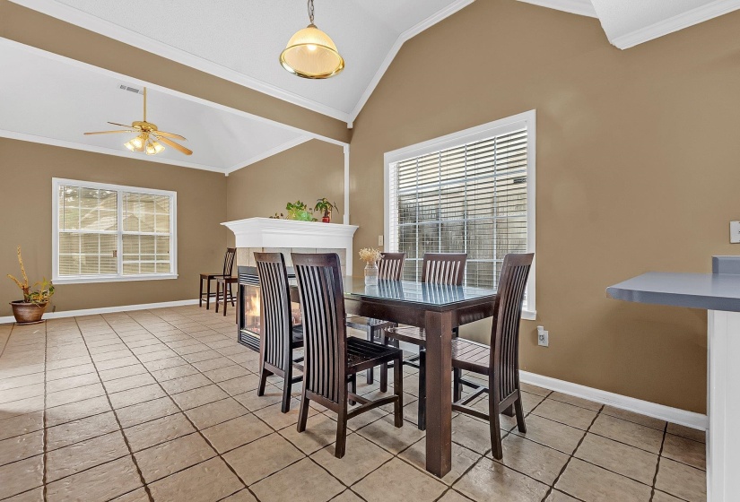 Spacious room with vaulted ceilings and crown molding